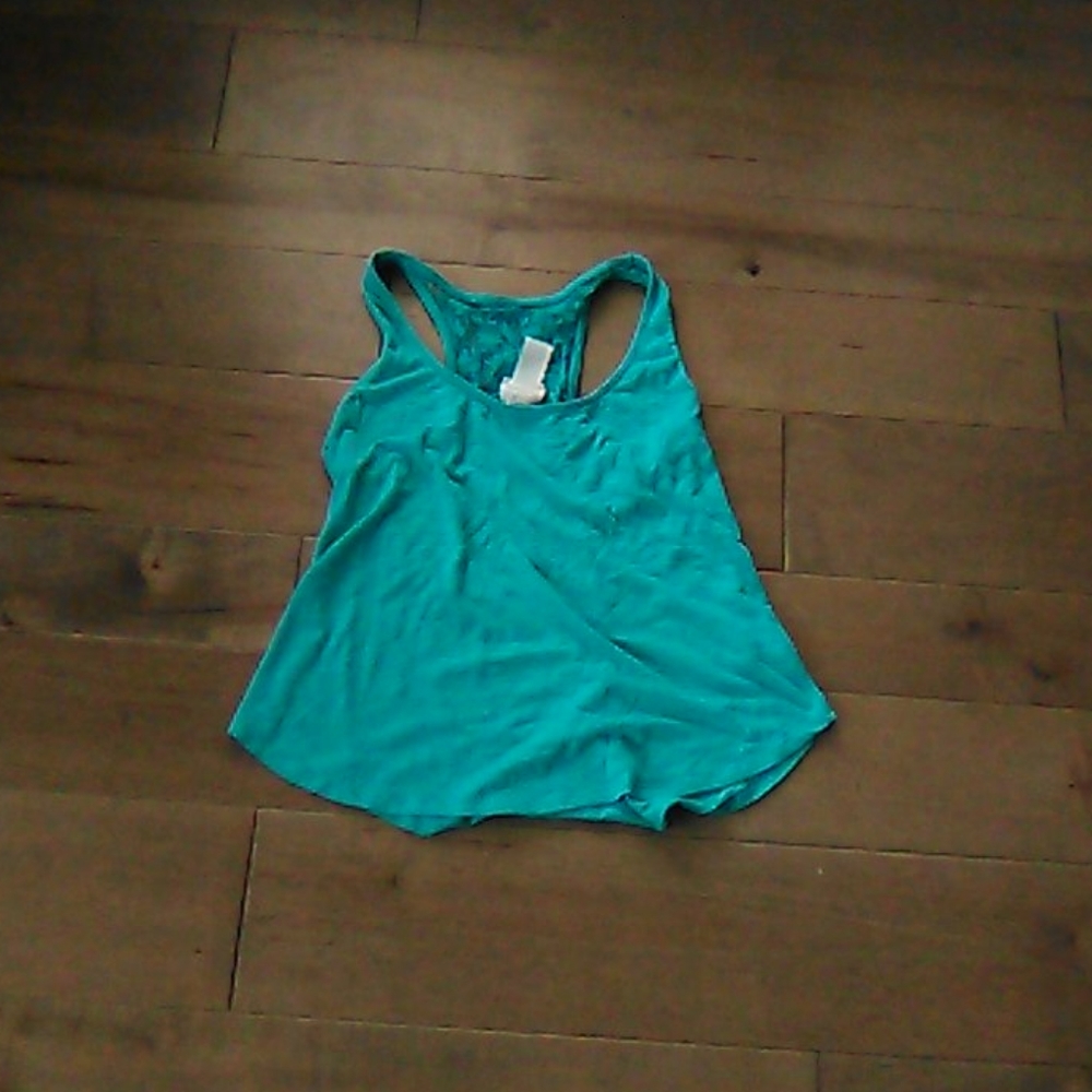 Turquoise tank top with flower see through back.